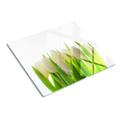 Glazen snijplanken Tulpen tegen een achtergrond van groene bladeren