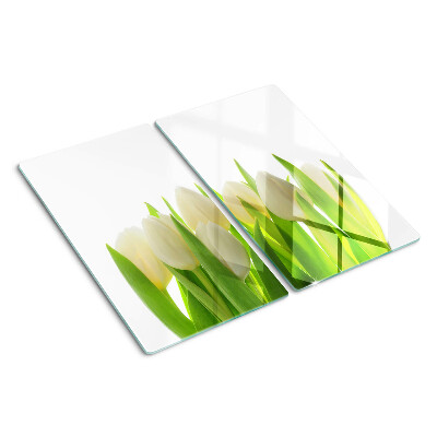 Glazen snijplanken Tulpen tegen een achtergrond van groene bladeren