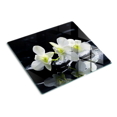 Glazen snijplanken Orchideeën op een zwarte achtergrond
