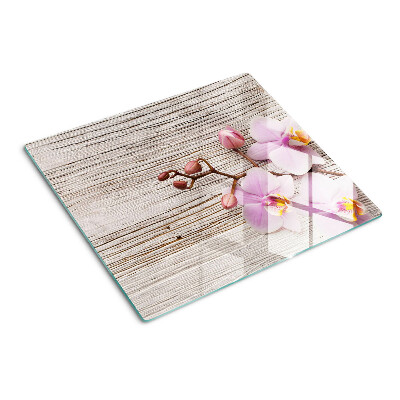 Glazen snijplanken Orchideeën op een houten achtergrond