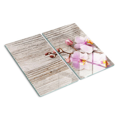 Glazen snijplanken Orchideeën op een houten achtergrond