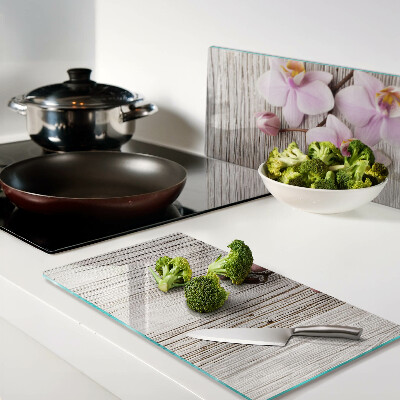 Glazen snijplanken Orchideeën op een houten achtergrond