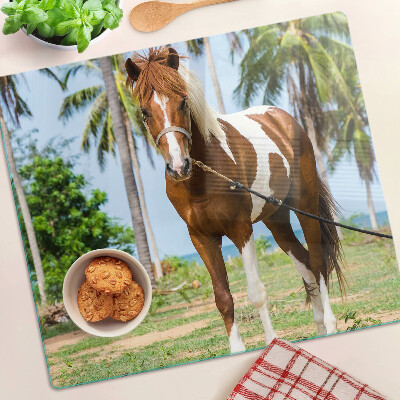 Glazen snijplanken Een paard met palmbomen op de achtergrond
