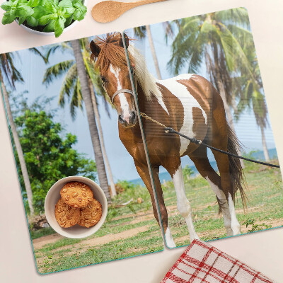 Glazen snijplanken Een paard met palmbomen op de achtergrond