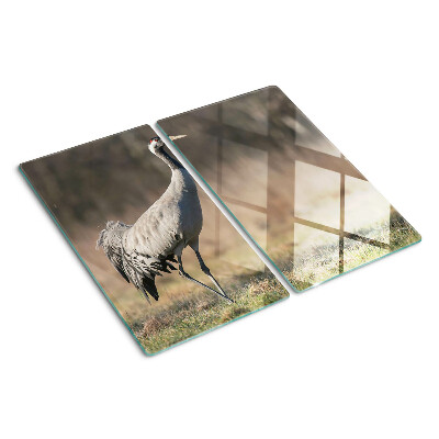 Snijplanken glas Een kraan tegen de achtergrond van een landschap