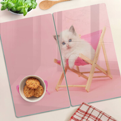 Glazen snijplanken Kitten op een ligstoel op een roze achtergrond