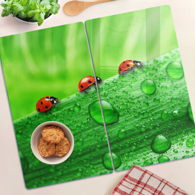 Glazen snijplanken Lieveheersbeestjes op een groene achtergrond