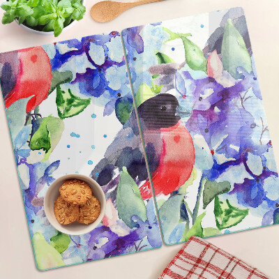 Glazen snijplanken Vogel op een achtergrond van bloemen