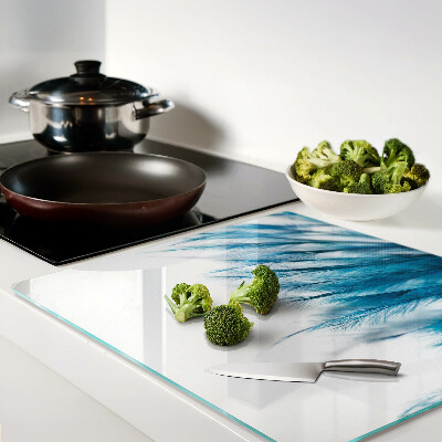 Snijplanken glas Blauwe veren op een witte achtergrond