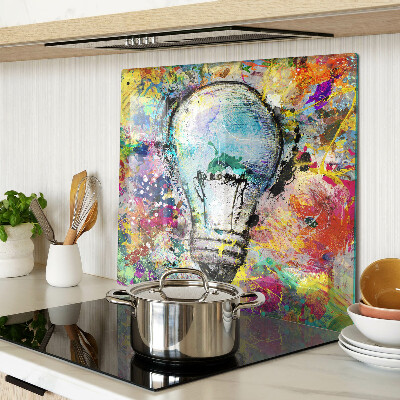 Snijplanken glas Gloeilamp op een gekleurde achtergrond