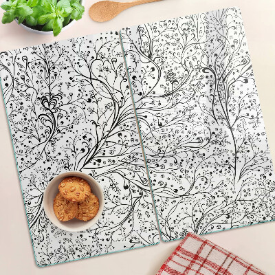Glazen snijplanken Een plantenpatroon met delicate takken