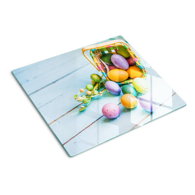Snijplanken glas Paaskleurige eieren in een mandje