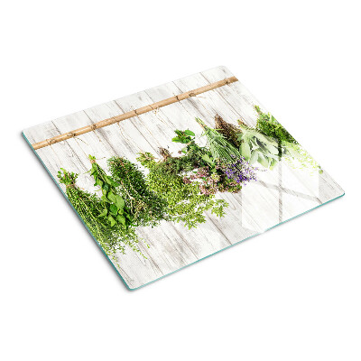 Glazen snijplanken Kruiden op een houten achtergrond