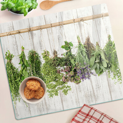 Glazen snijplanken Kruiden op een houten achtergrond
