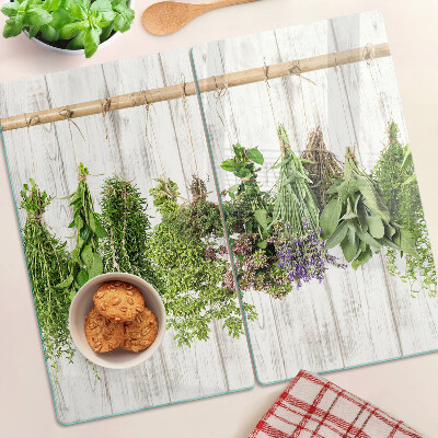 Glazen snijplanken Kruiden op een houten achtergrond