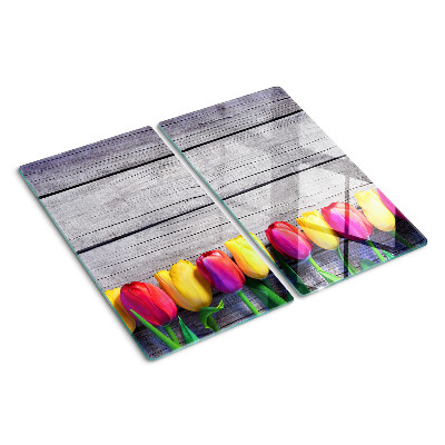 Glazen snijplanken Tulpen op een houten achtergrond