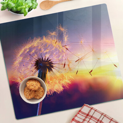 Glazen snijplanken Paardenbloemen tegen de zonsondergang