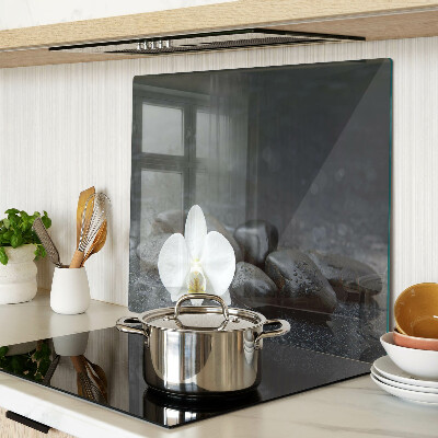 Snijplanken glas Orchideebloem op stenen