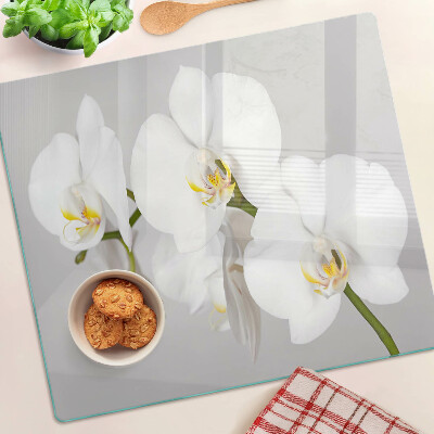Glazen snijplanken Orchideeën op een spiegelachtergrond