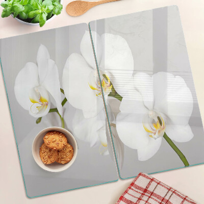 Glazen snijplanken Orchideeën op een spiegelachtergrond