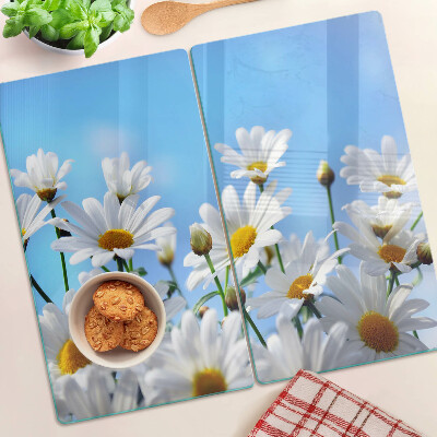 Snijplanken glas Madeliefjes op een blauwe achtergrond