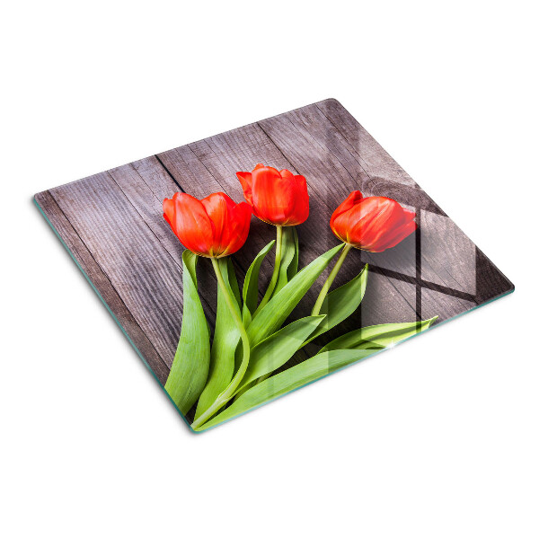 Glazen snijplanken Tulpen op een houten achtergrond