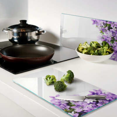 Snijplanken glas Paarse bloemen op de achtergrond
