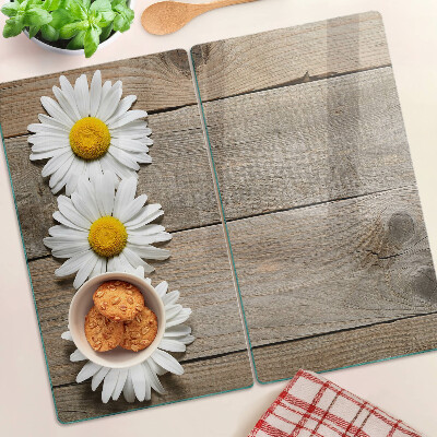 Glazen snijplanken Bloemen op een houten achtergrond