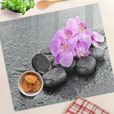 Glazen snijplanken Bloemen en stenen tegen het water