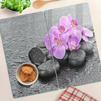 Glazen snijplanken Bloemen en stenen tegen het water