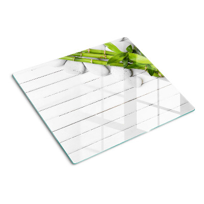 Snijplanken glas Bamboe en stenen op een houten achtergrond