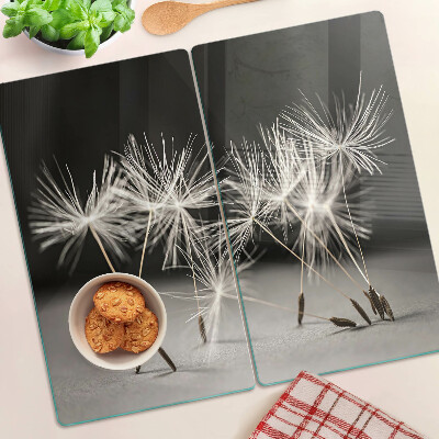 Snijplanken glas Pluizige paardenbloemen op een monochromatische achtergrond