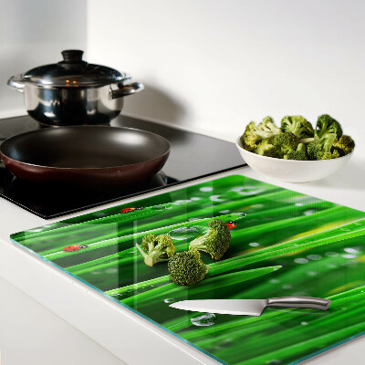 Snijplanken glas Waterdruppels op gras met lieveheersbeestjes