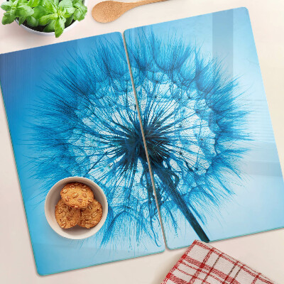 Glazen snijplanken Paardenbloem op een blauwe achtergrond