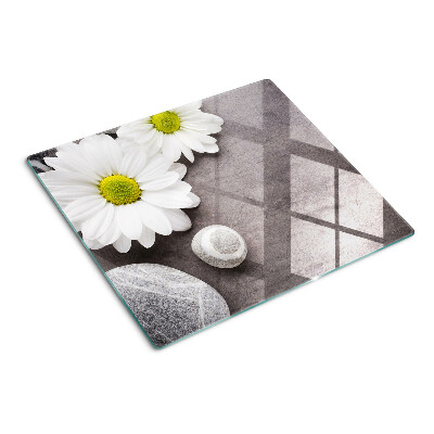 Glazen snijplanken Bloemen en stenen op de achtergrond
