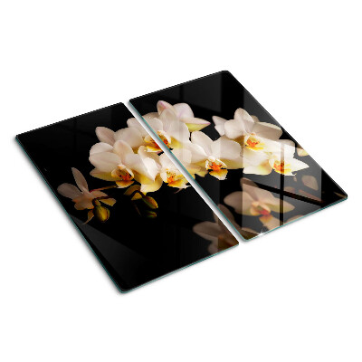 Glazen snijplanken Orchideeën op een zwarte achtergrond