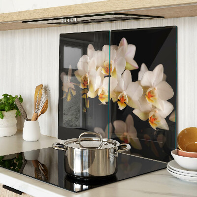 Glazen snijplanken Orchideeën op een zwarte achtergrond