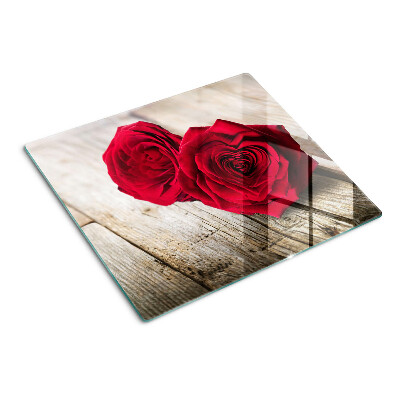 Snijplanken glas Rode rozen op een houten achtergrond