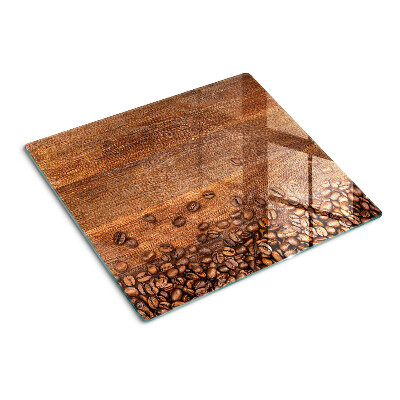 Glazen snijplanken Koffiebonen op houten achtergrond