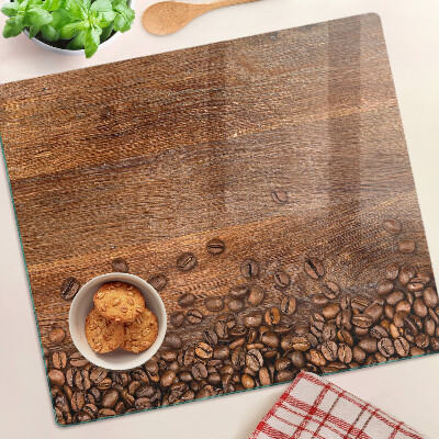 Glazen snijplanken Koffiebonen op houten achtergrond