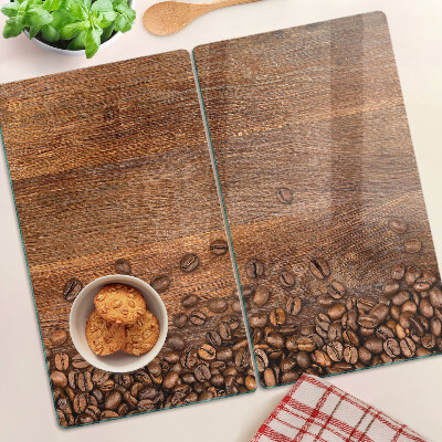 Glazen snijplanken Koffiebonen op houten achtergrond