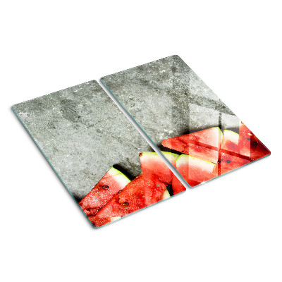 Snijplanken glas Watermeloenschijfjes op een grijze achtergrond
