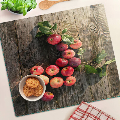 Glazen snijplanken Appels op een houten achtergrond