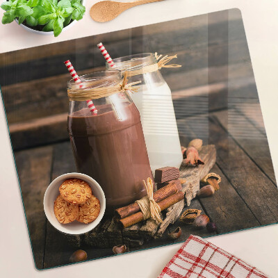 Snijplanken glas Potten met drankjes op een houten achtergrond