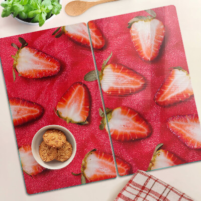 Glazen snijplanken Aardbeien op een roze achtergrond