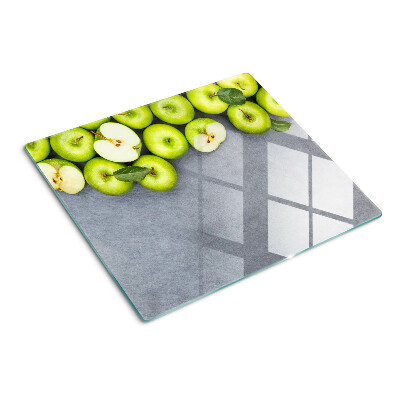 Glazen snijplanken Groene appels op een grijs oppervlak
