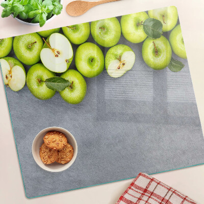 Glazen snijplanken Groene appels op een grijs oppervlak