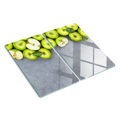 Glazen snijplanken Groene appels op een grijs oppervlak