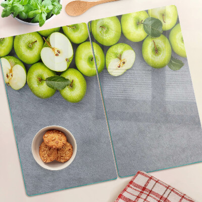 Glazen snijplanken Groene appels op een grijs oppervlak