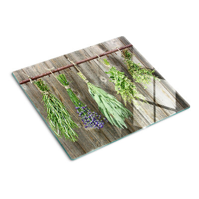 Snijplanken glas Kruiden op een houten achtergrond
